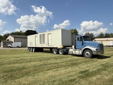 Caterpillar generator container photographed from back-left side.