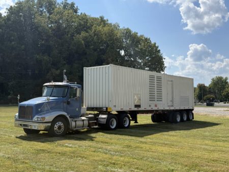 Front-left exterior view of Caterpillar generator container.