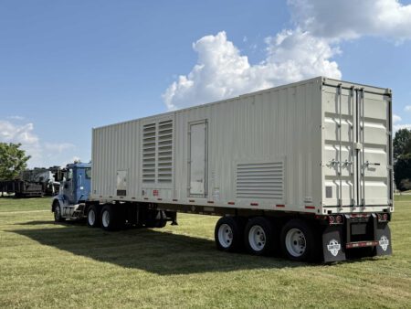 Front-right exterior view of Caterpillar generator container.