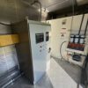 Generator control panel and fuel filtration system inside container.