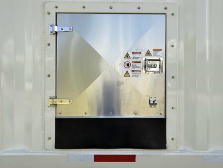 Closed load connection compartment on Caterpillar generator container.