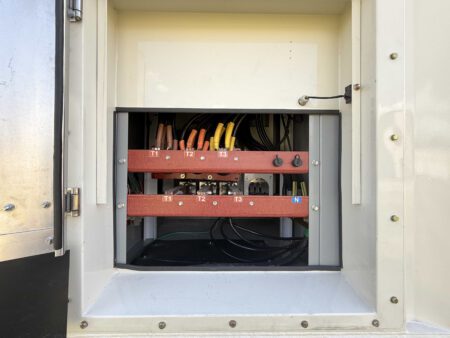 Open load compartment showing generator bus bars and connections.