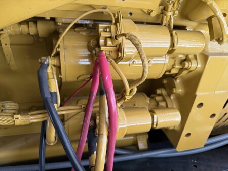 Starter motor assembly with battery cable connections.