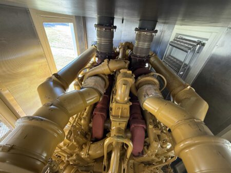 Top-down view of Caterpillar 3516 turbochargers and exhaust outlets.