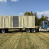 Rear view of containerized CAT C27 generator mounted on trailer.