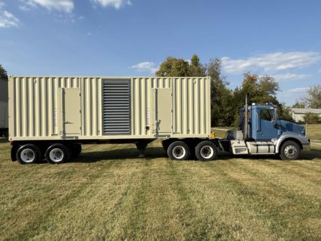 Rear view of containerized CAT C27 generator mounted on trailer.