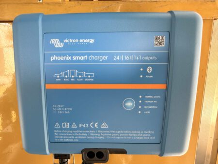 Victron Energy Phoenix Smart Charger installed in generator enclosure.