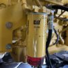 Caterpillar 513-4490 fuel filter and water separator on C27 engine.