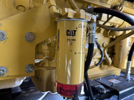 Caterpillar 513-4490 fuel filter and water separator on C27 engine.