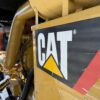 Caterpillar logo panel on generator enclosure.