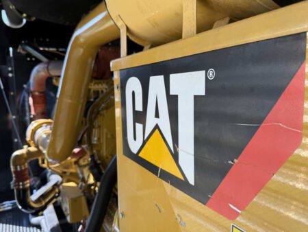 Caterpillar logo panel on generator enclosure.