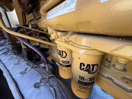 Dual Caterpillar 1R-1808 engine oil filters installed on CAT C27 generator.