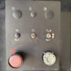 Control panel with adjustment switches and stop button.