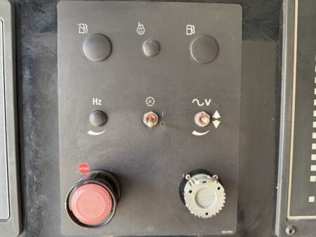 Control panel with adjustment switches and stop button.