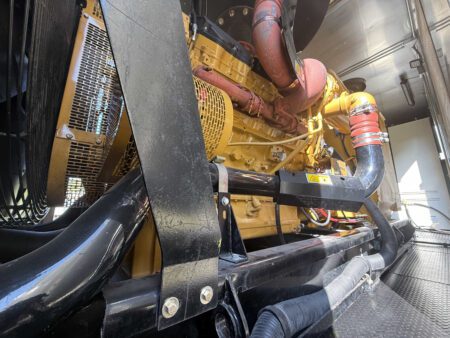 Caterpillar C27 diesel engine overall view inside generator container.