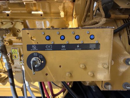 Engine-mounted control and start panel on Caterpillar C27 generator.