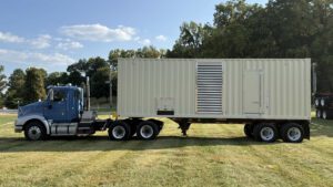 Front view of Caterpillar C27 generator container on trailer.