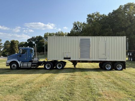 Front view of Caterpillar C27 generator container on trailer.