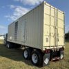 Containerized Caterpillar generator set viewed from the rear-right.