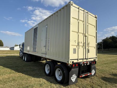 Containerized Caterpillar generator set viewed from the rear-right.