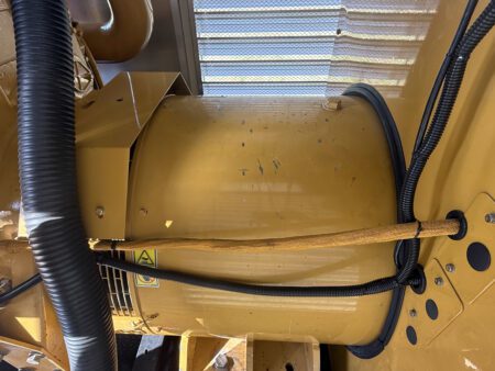 Left-side view of the Caterpillar generator end with protective housing.