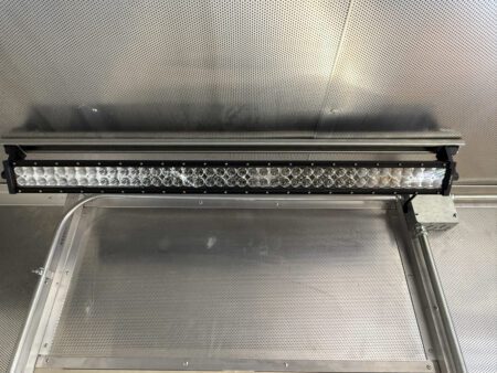 Interior LED lighting bar mounted to container ceiling.