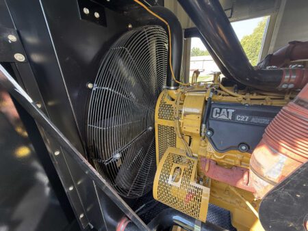 Left-side view of Caterpillar C27 engine radiator and cooling fan.