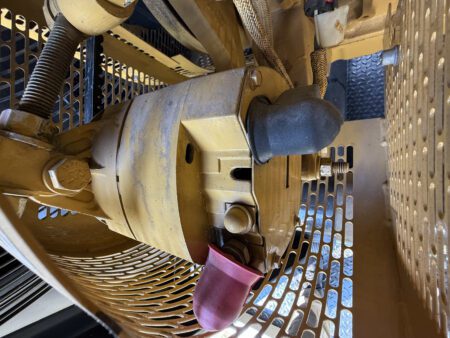 Caterpillar C27 engine starter motor with electrical connections.