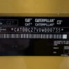 Caterpillar C27 product identification tag with model and serial number.