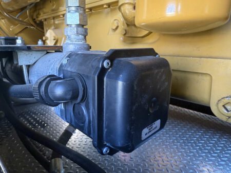 Engine coolant heater installed on Caterpillar C27.