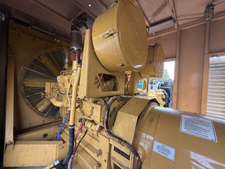 Caterpillar 3508B generator engine front side with radiator and alternator.
