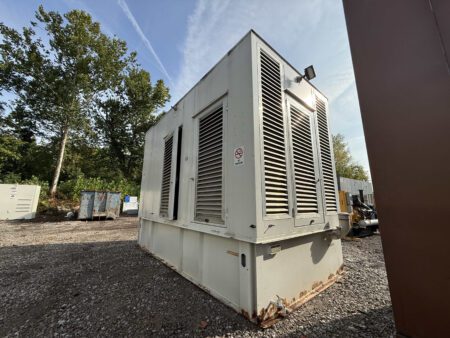 Caterpillar 3508B generator enclosure front-right corner view.