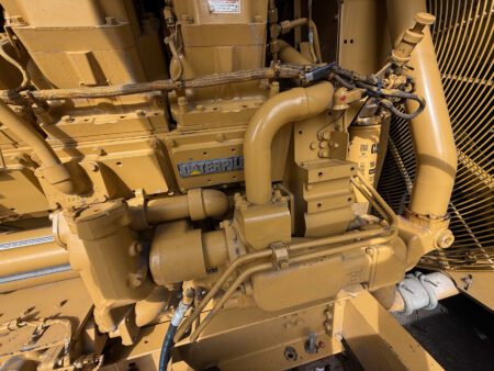 Caterpillar 3508B water pump and coolant piping assembly.