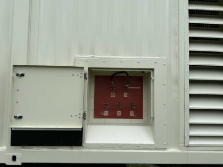 Open generator output terminal box exposing electrical connections.