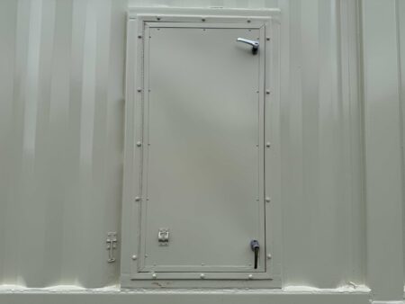 Closed personnel access door on generator container side.