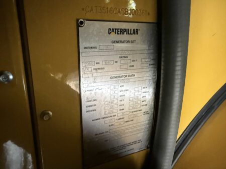 Caterpillar generator set nameplate displaying power ratings, model, and electrical specifications.