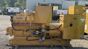 Side view of 1988 Caterpillar 3412 600kW diesel generator with breaker enclosure