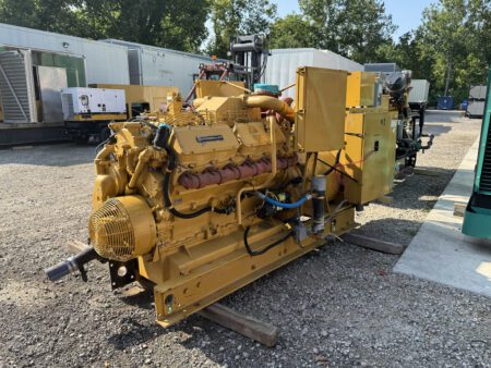 Front side angle of 1988 Caterpillar 3412 600kW diesel generator set with skid base and breaker cabinet