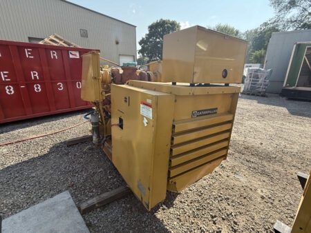 Rear angle view of 1988 Caterpillar 3412 600kW diesel generator with breaker cabinet