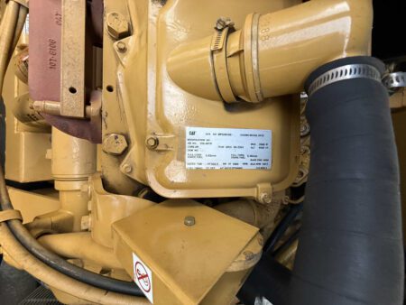 Engine information plate on 2000 CAT 3412 generator showing Model 3412 and genset S/N BPG00168.