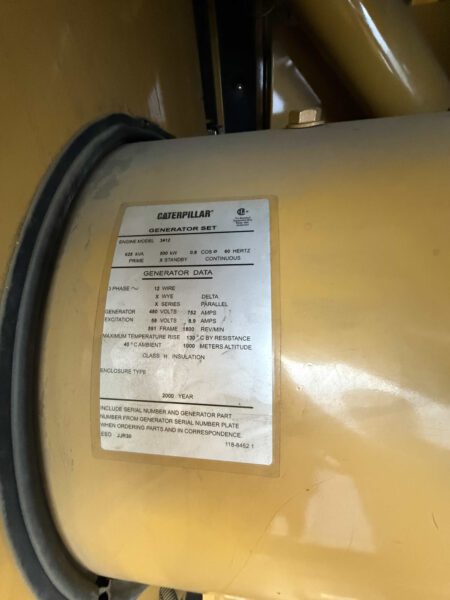 Generator nameplate on 2000 CAT 3412 set showing 500 kW / 625 kVA, 480/277 V, 60 Hz, 3-phase 12-wire, 752 A, Class H, year 2000.