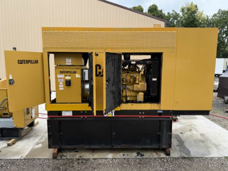 2003 Caterpillar 3306 250kW diesel generator with sound-attenuated enclosure, rear doors open.