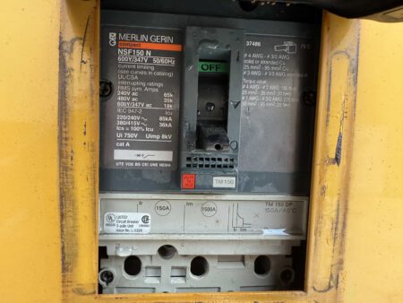 Close-up of Merlin Gerin NSF150 N 150A circuit breaker inside a 2003 Caterpillar 3306 250kW generator.