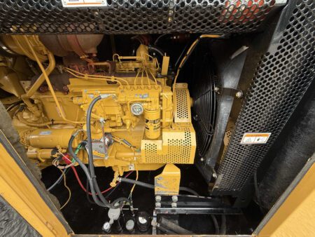 Interior view of 2003 Caterpillar 3306 250kW generator showing engine and alternator assembly.