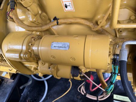 Close-up of Caterpillar starter motor on 2003 CAT 3306 250kW generator engine.