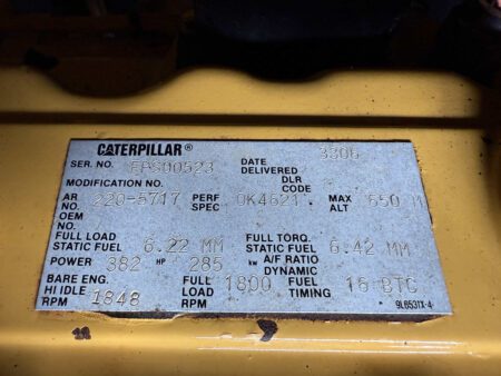 Caterpillar engine data plate for 3306 engine, serial number EPS00523, on 2003 CAT 3306 250kW generator.