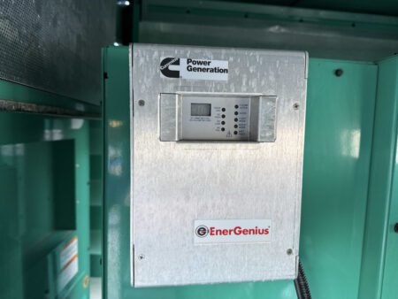 Cummins Power Generation EnerGenius battery charger mounted inside the generator enclosure.