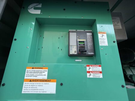 Main circuit breaker inside the enclosure of a 2018 Cummins DFEK 500kW diesel generator set.