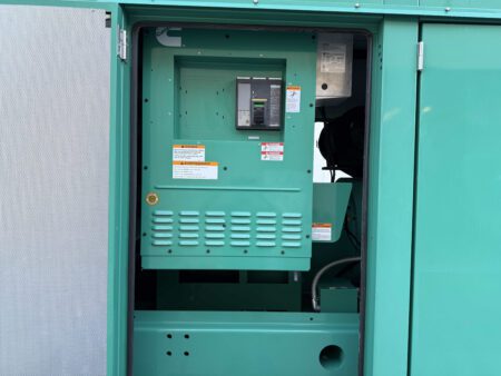 Breaker compartment of a 2018 Cummins DFEK 500kW diesel generator set with access door open.