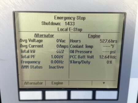 Close-up of the Cummins PowerCommand control panel showing 527.6 operating hours on a 2018 DFEK 500kW diesel generator.